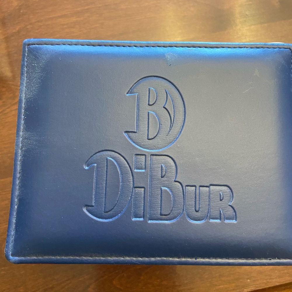 DiBur woman’s stainless steel watch with authentic stingray band.